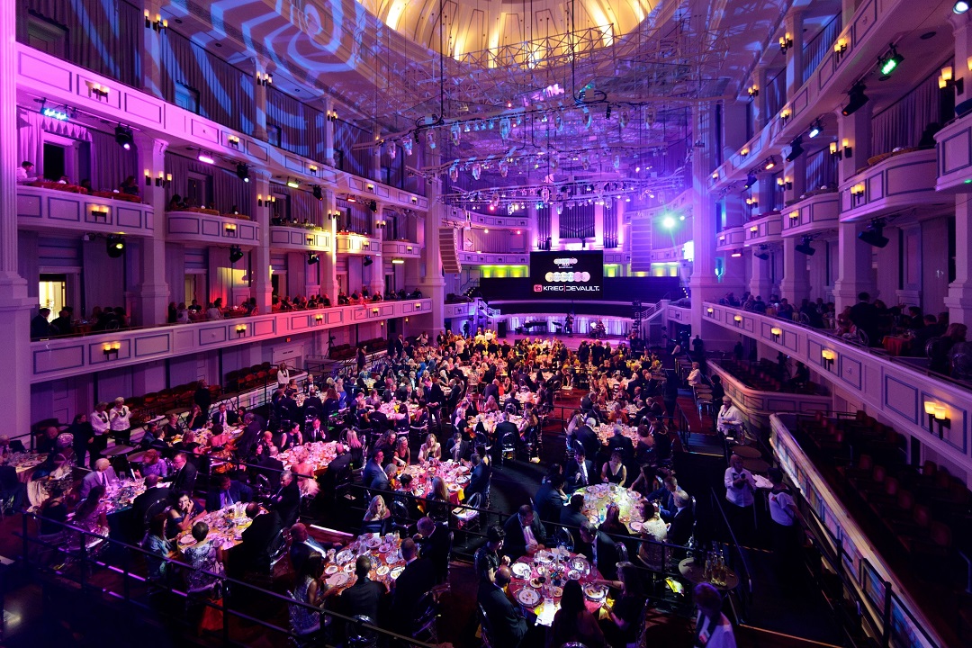 The Palladium concert hall is bathed in colored lights as guests dine on the Festival Floor.