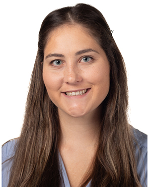 Headshot of a young woman with long brown hair in a part