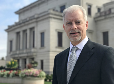 President/CEO Jeff McDermott poses outside the Palladium concert hall