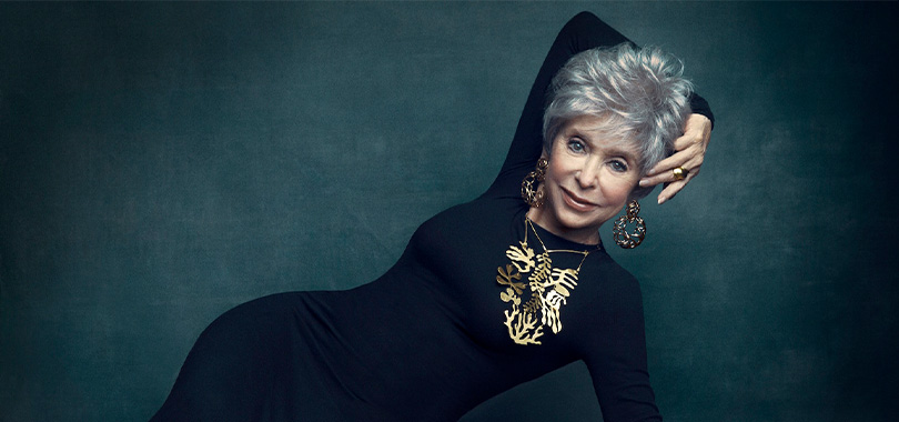 Rita Moreno Rita Moreno lying sideways with her arm over her head