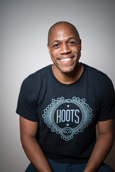 Comedian Dwight Simmons smiles for a portrait