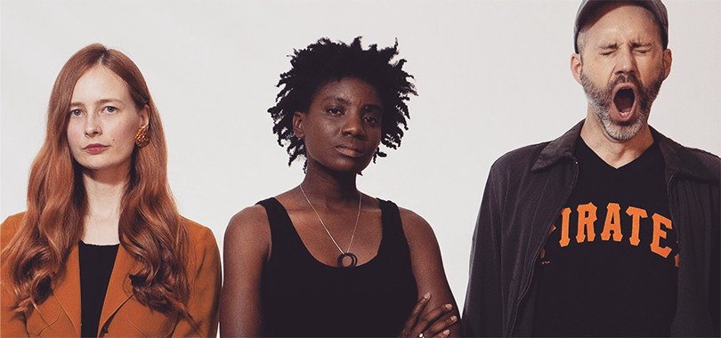 Live at the Center: Wife Patrol The three members of Wife Patrol stand before a white background. One is yawning.