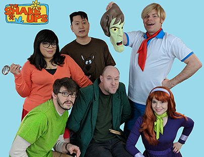 Six young men and women are dressed as characters from the animated series “Scooby Doo.”