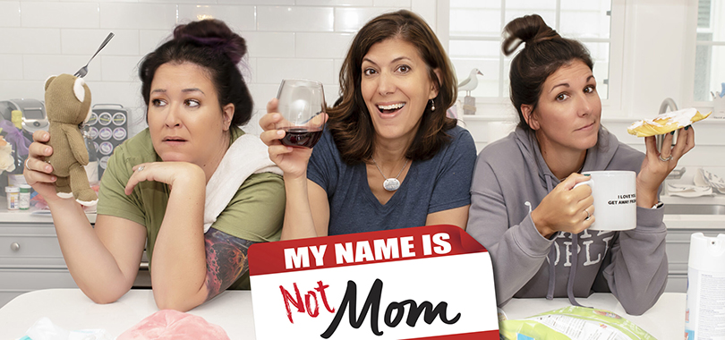 Three white women in their 40s at a kitchen counter surrounded by toys. A logo in the shape of a nametag reads "My Name is Not Mom: Meredith Masony, Tiffany Jenkins, Dena Blizzard"