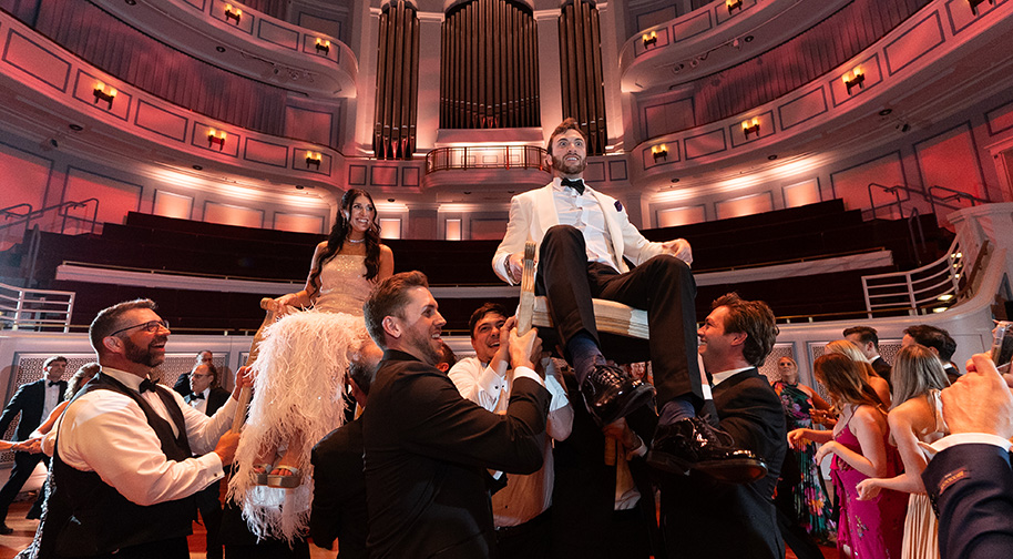 Wedding guests dance the horah on the Payne & Mencias Palladium stage.