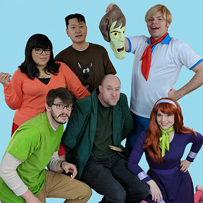 Six men and women are dressed as characters from the "Scooby Doo" TV show.