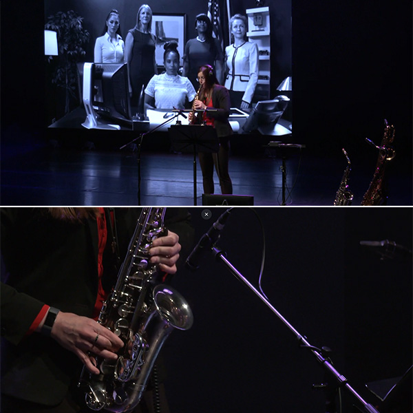 Cecily Terhune performing on saxophone against a projected video showing women in various powerful professional roles.